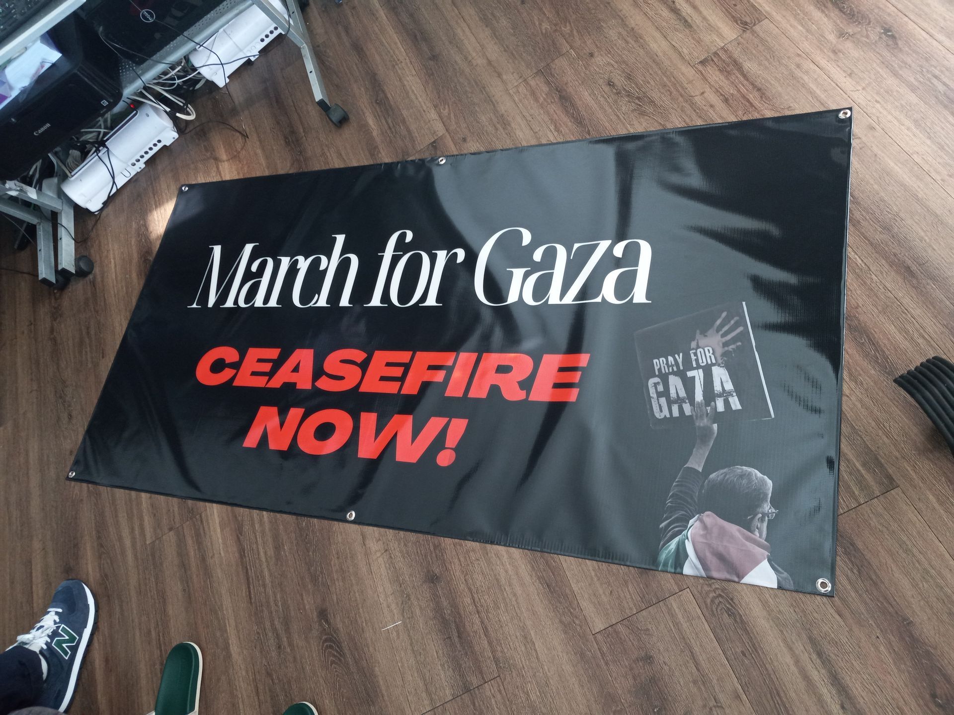A black banner says march for gaza ceasefire now