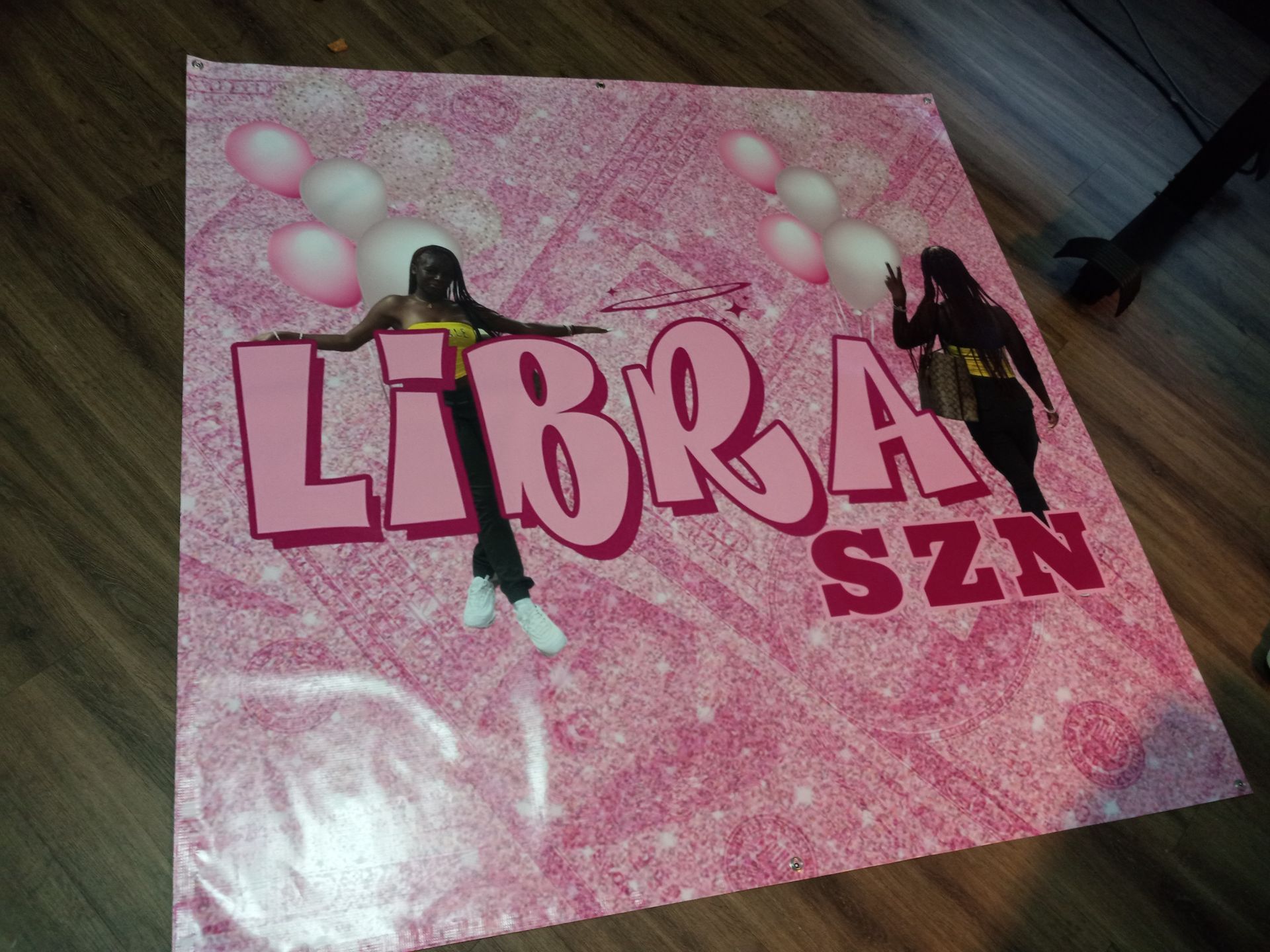 A pink sign that says libra szn on it