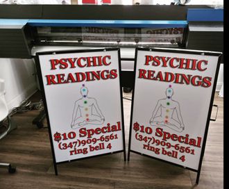 Two signs that say psychic readings on them