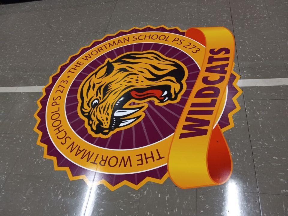 A logo for the worthman school ps 275 wildcats