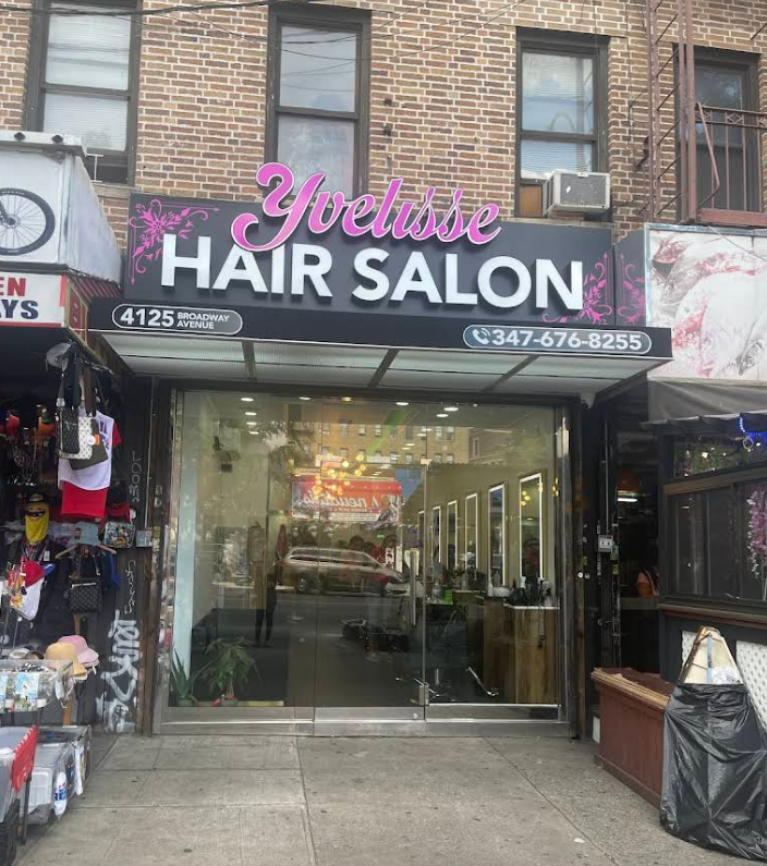 A hair salon is located in a brick building