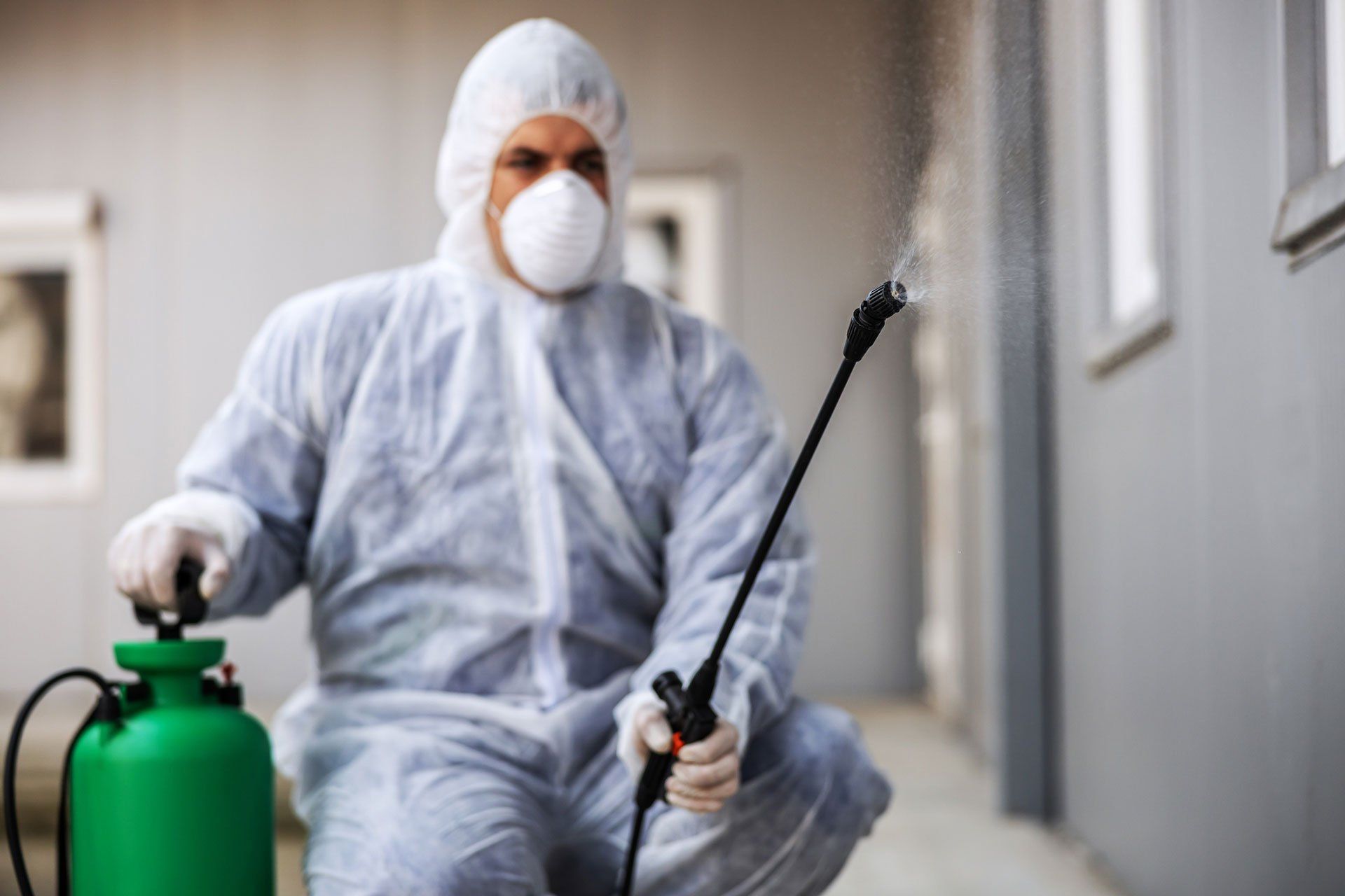 Exterminator performing a residential pest control service
