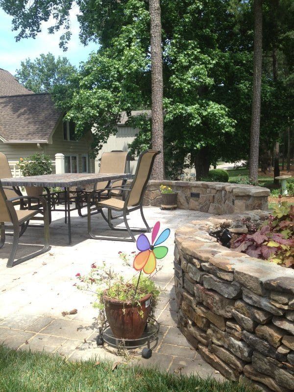 A patio with a table and chairs and a pinwheel