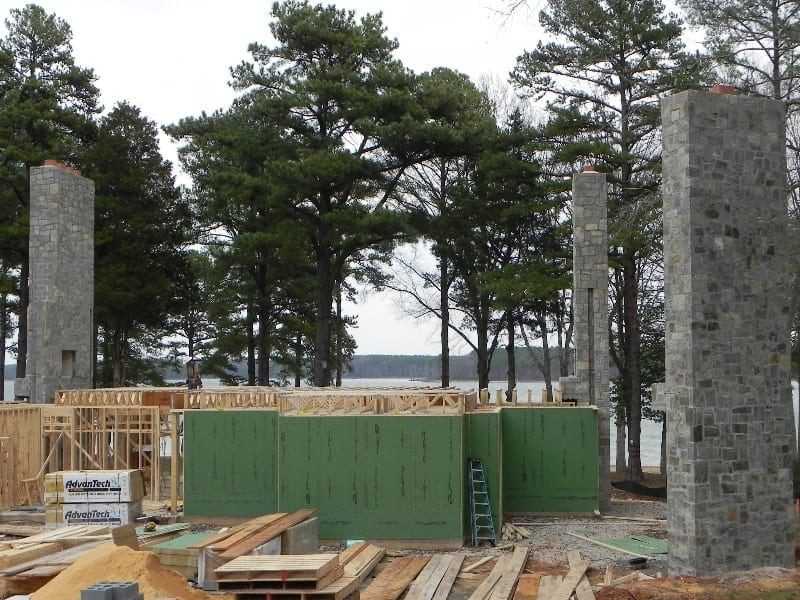 A building under construction with a ladder in the foreground