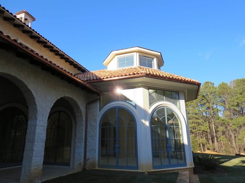 A large building with arches and a tiled roof