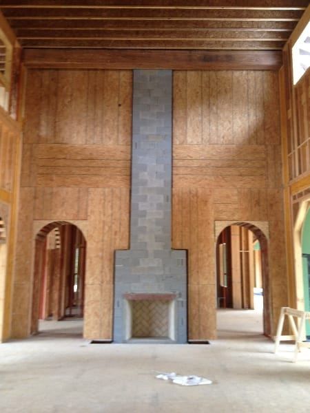 A large room with a fireplace in the middle of it