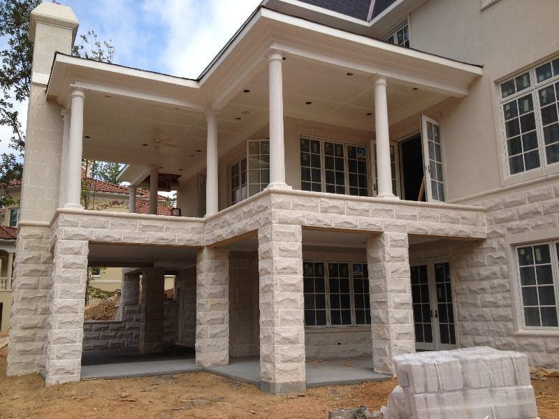 A large house with a lot of windows and columns