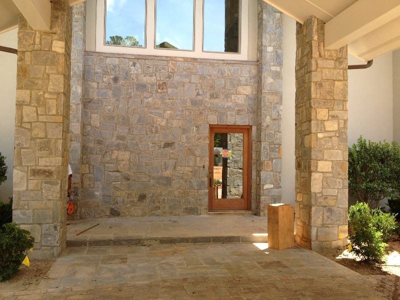 A large stone building with a wooden door