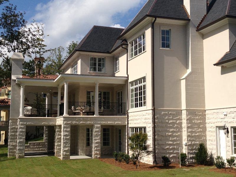 A large white house with a black roof