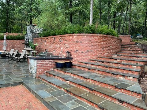 A large white house with a brick porch