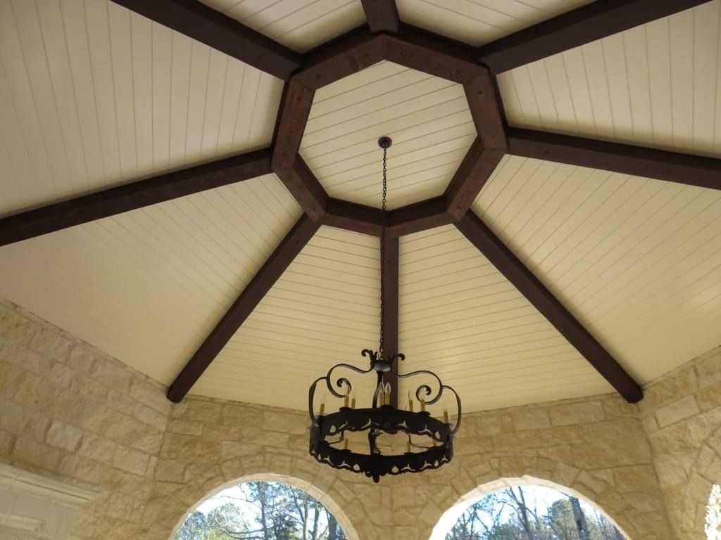 A chandelier is hanging from the ceiling of a building