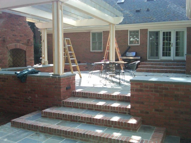 A brick house with stairs leading up to it