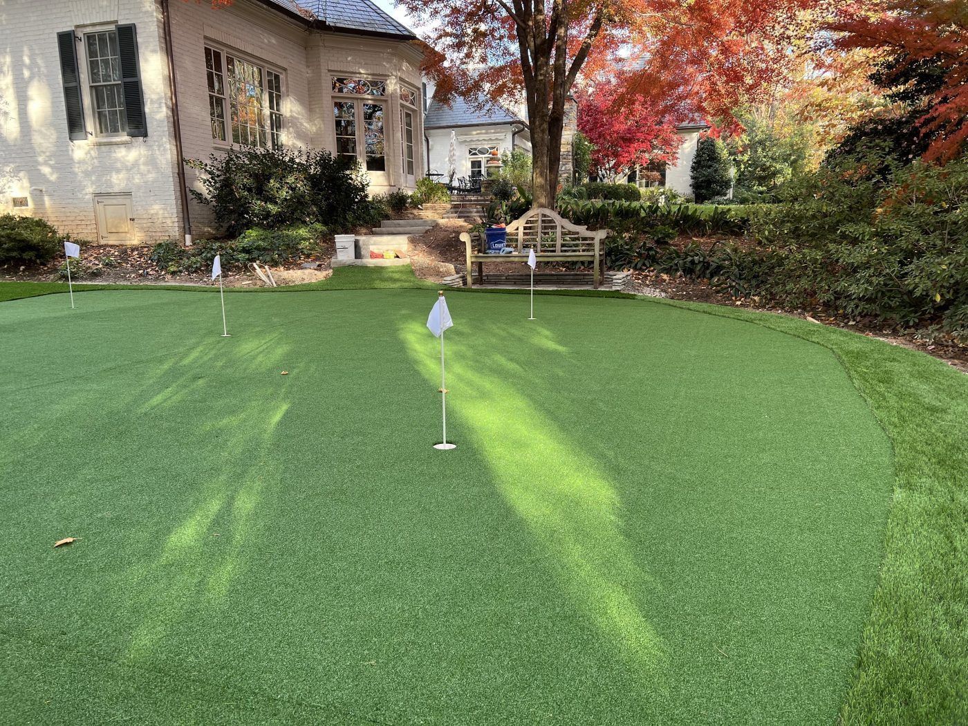 There is a putting green in front of a house