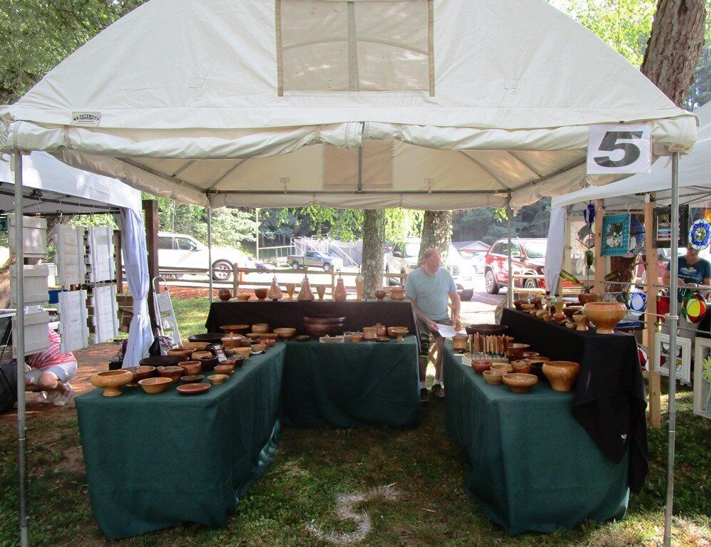A vendor's white tent with products on display