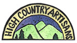 A logo for high country artisans with a mountain in the middle.