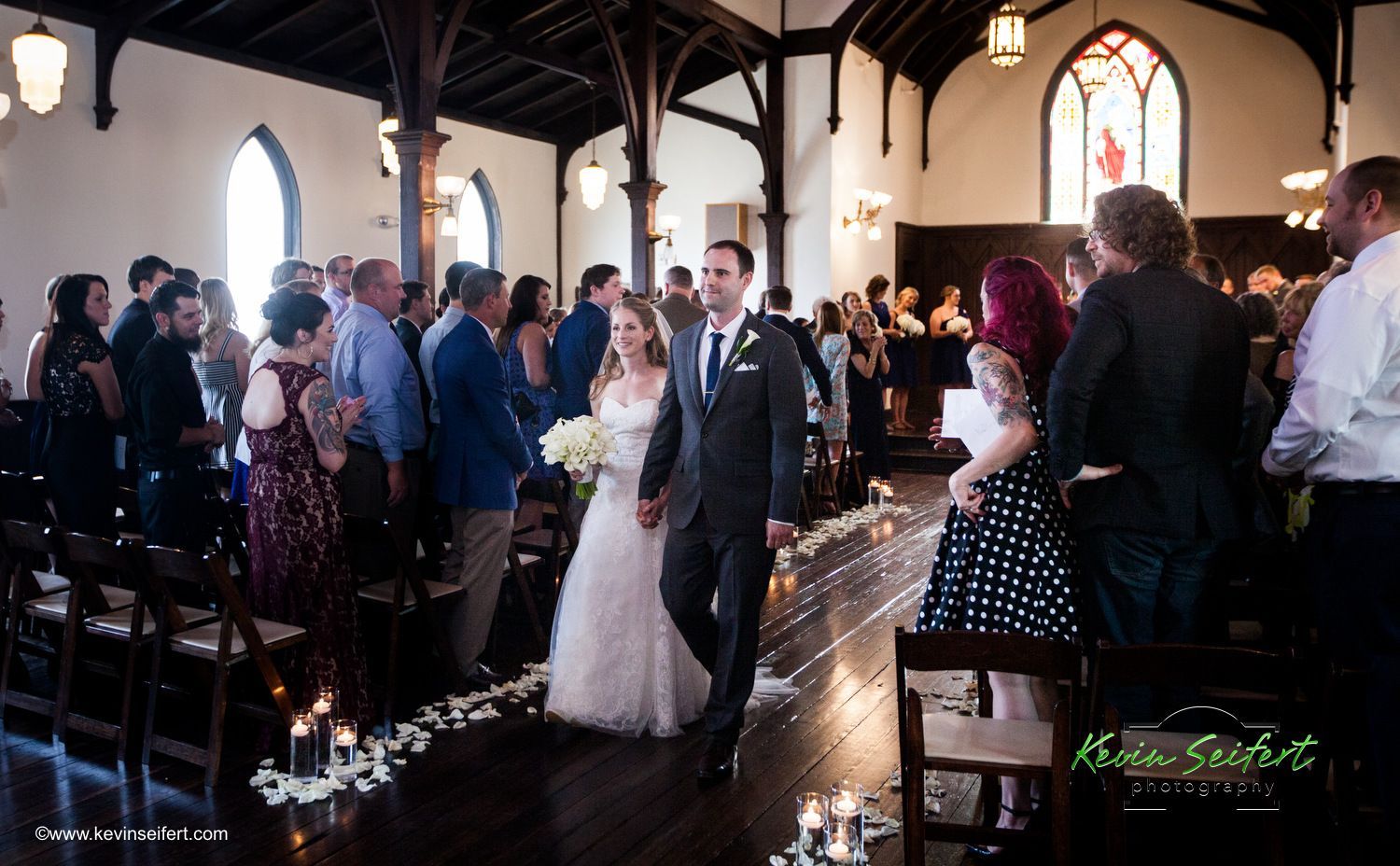 Couple walking down the aisle in a church — RTP, NC — RTP.Studio