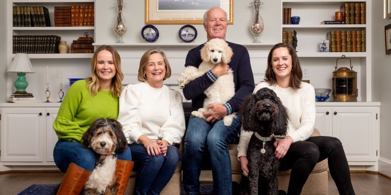 A group of people sitting on a couch with dogs — RTP, NC — RTP.Studio