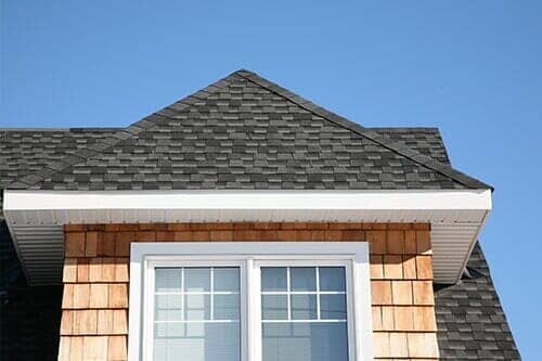 Dark Gray Roof with Wooden Siding - Florence, AL - River Restoration Roofing and Construction