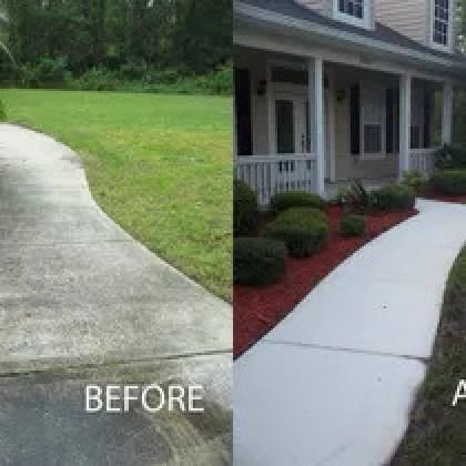 Before and after comparison of a driveway and walkway. One side is stained concrete, the other is freshly cleaned, with landscaping.