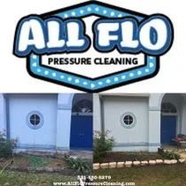 Before and after pressure cleaning of a white building with blue doors and trim.