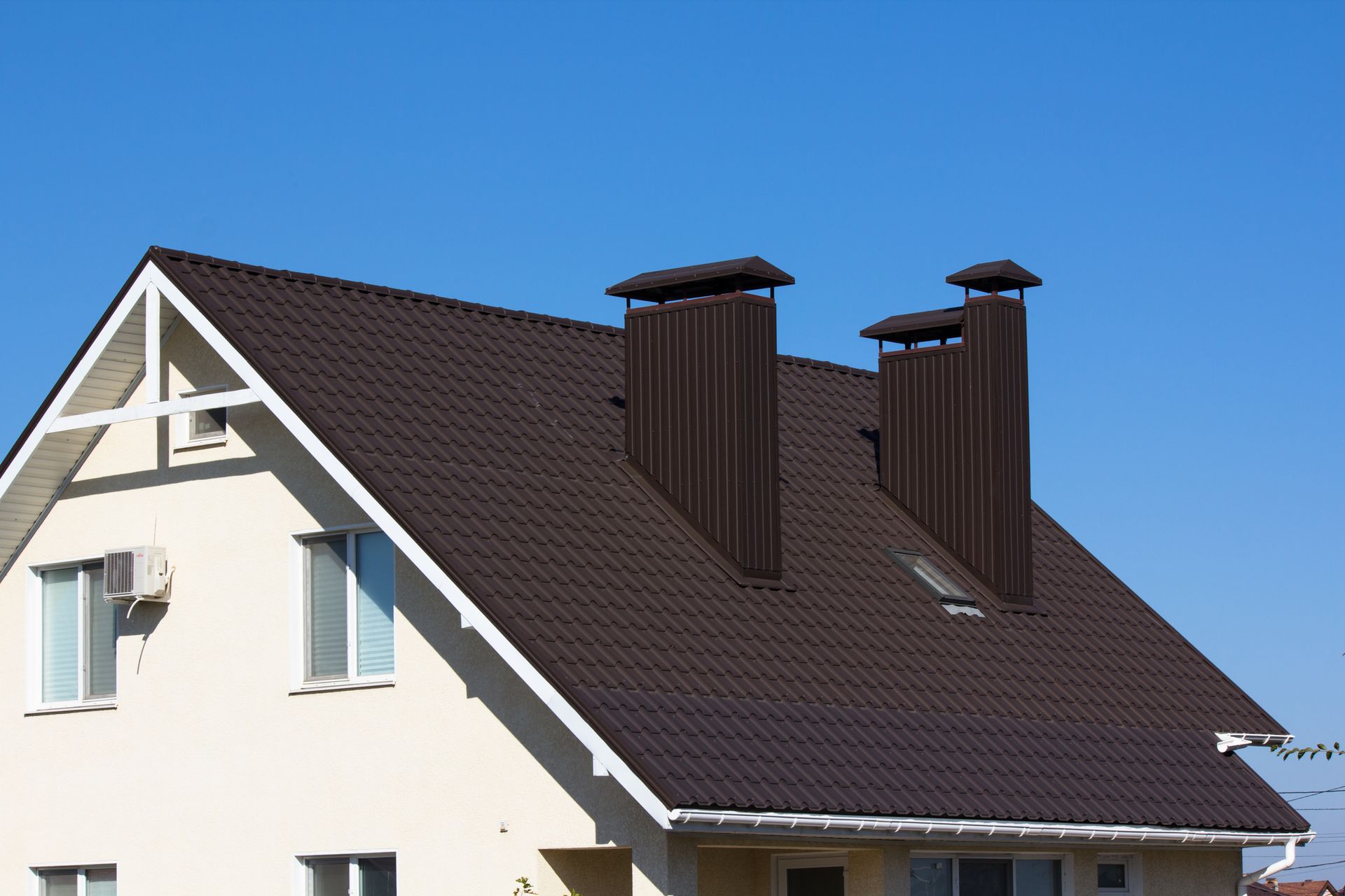 Roof of a house with chimneys.