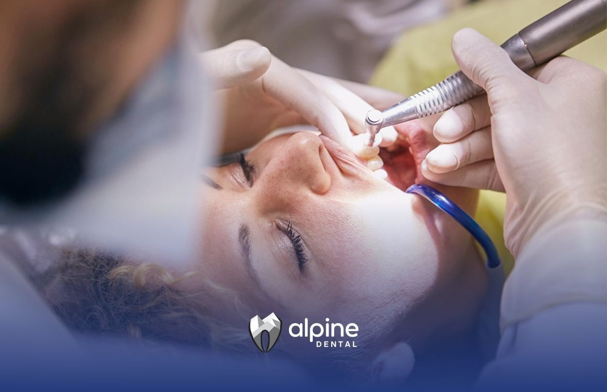 Woman receiving a full mouth reconstruction procedure with a drill at a dental clinic in Lakewood NJ