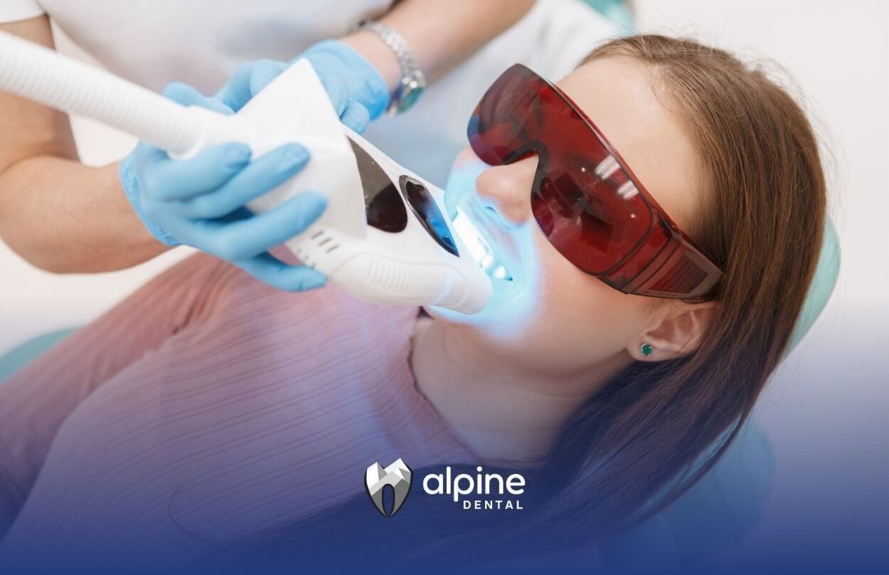 Patient receiving professional teeth whitening treatment.