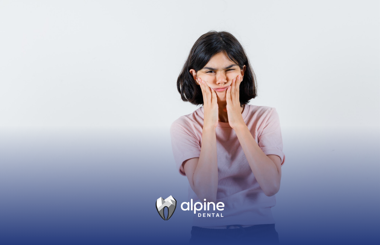 A woman is stressed and is holding her jaws