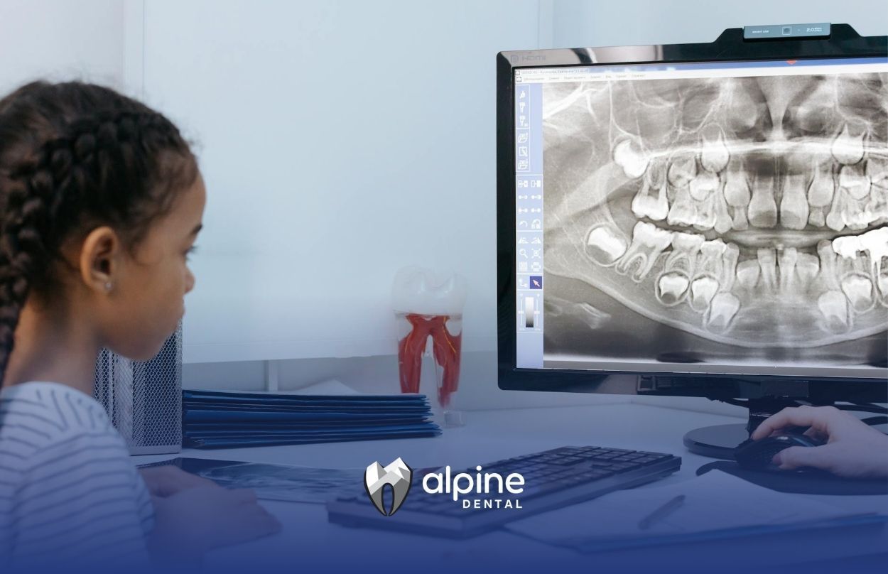A child viewing her dental X-ray on a computer screen during a dental appointment in Lakewood, NJ.