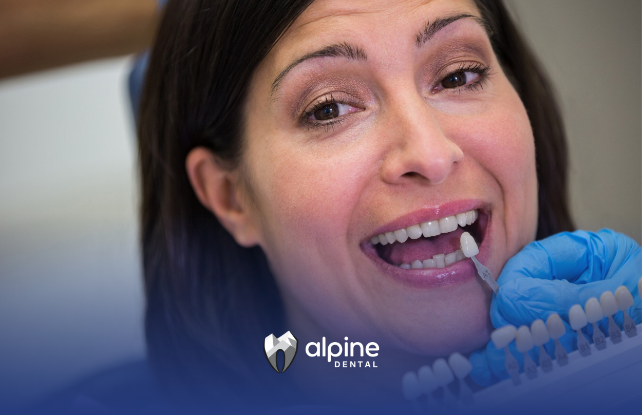 A woman is getting her teeth examined by a dentist.