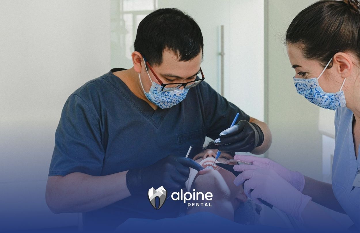A dental team examining patient's mouth closely during a dental checkup at a clinic in Lakewood, NJ.