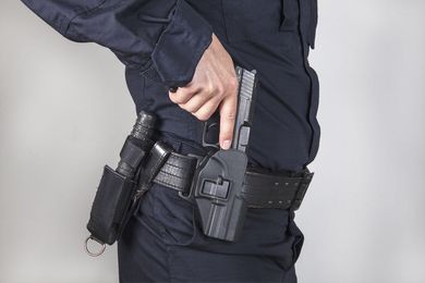 security holding a gun