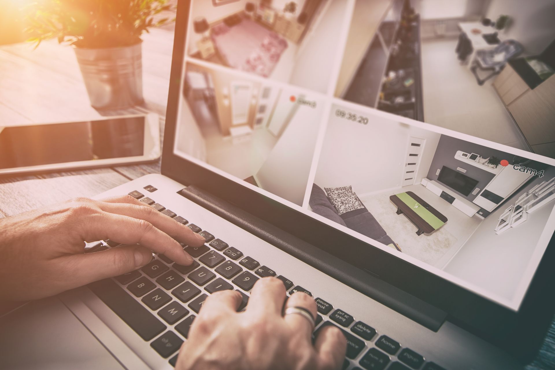 A person is typing on a laptop computer.