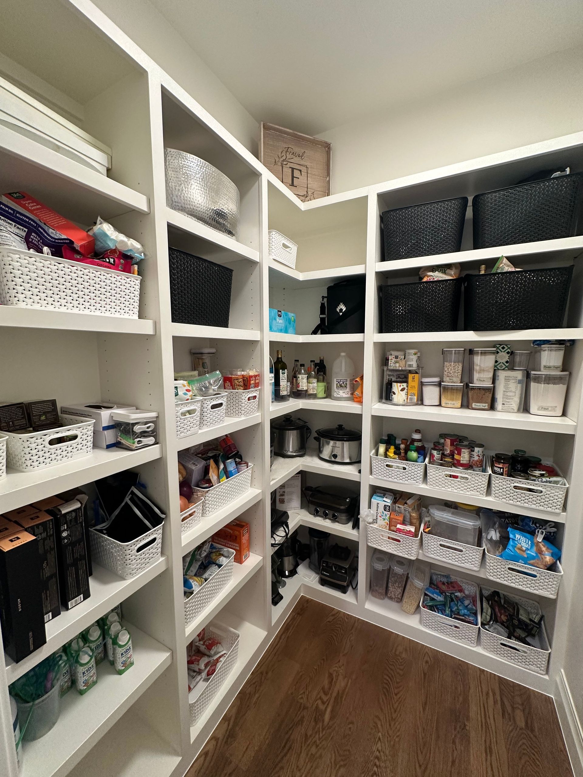 A pantry filled with lots of food and baskets.