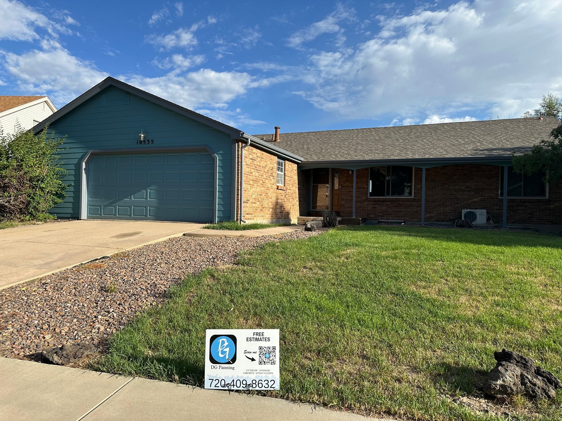A house with a for sale sign in front of it.