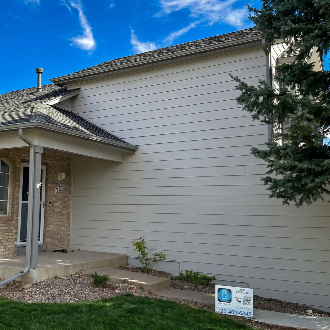 A large house with stairs leading up to the second floor