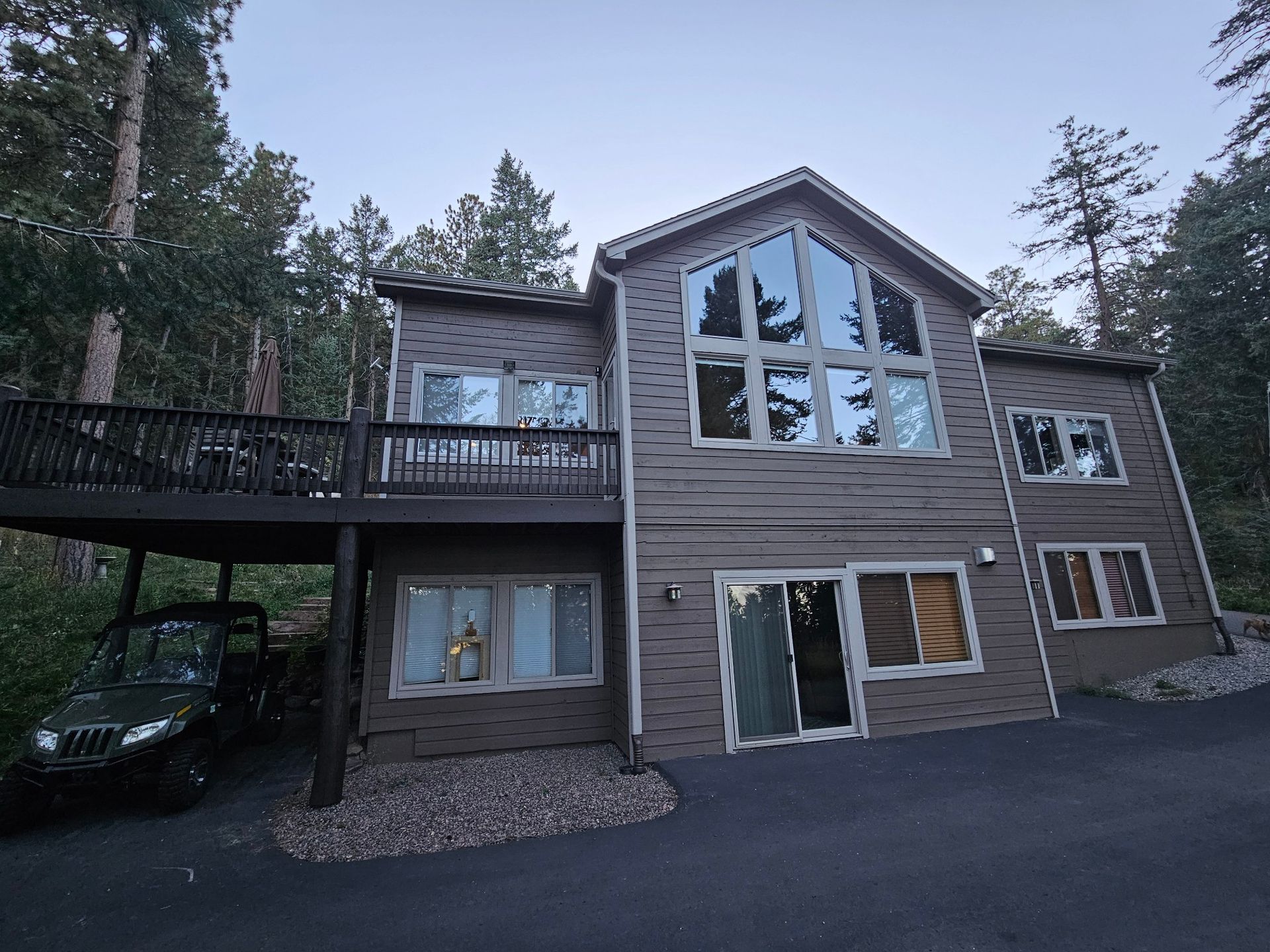 A large house with a car parked in front of it