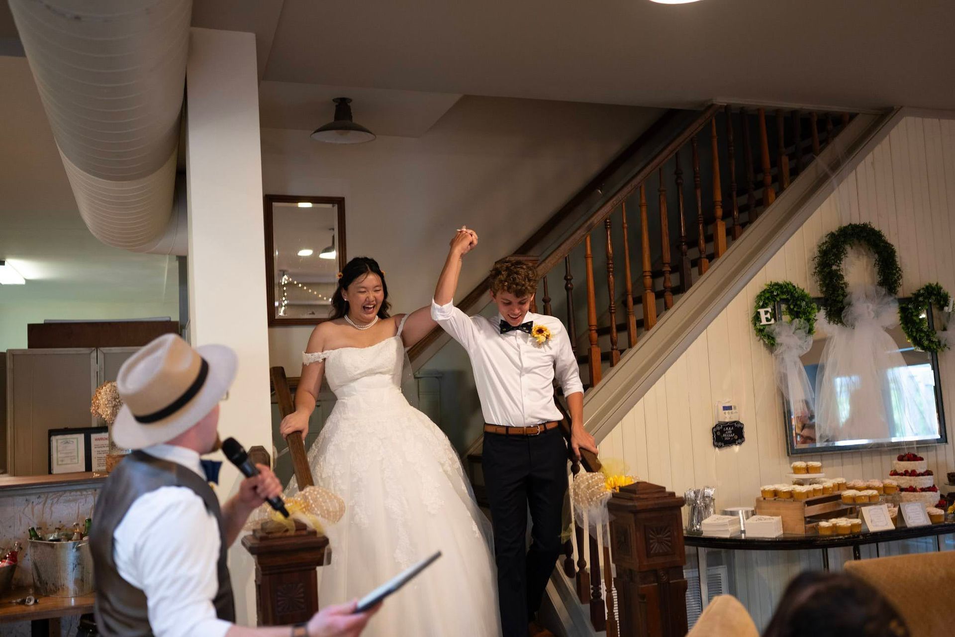 Couple descending the interior staircase that leads to the loft