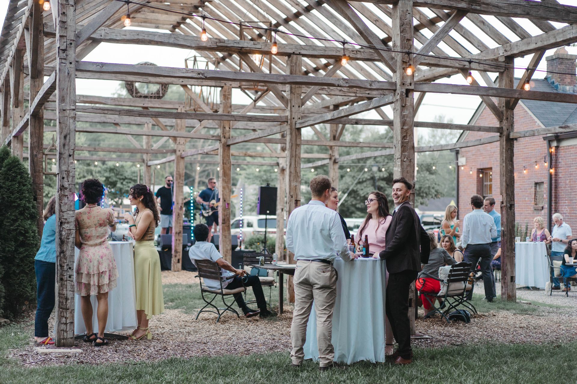 Guests enjoying cocktail hour under the pergola at 314 Exchange