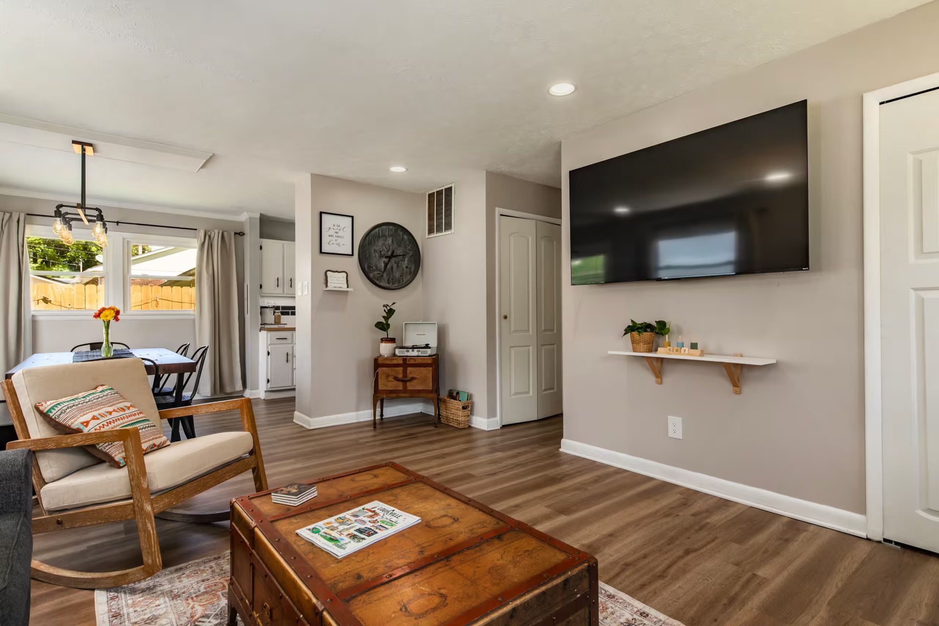 LumosStays living room with sofa and dining area