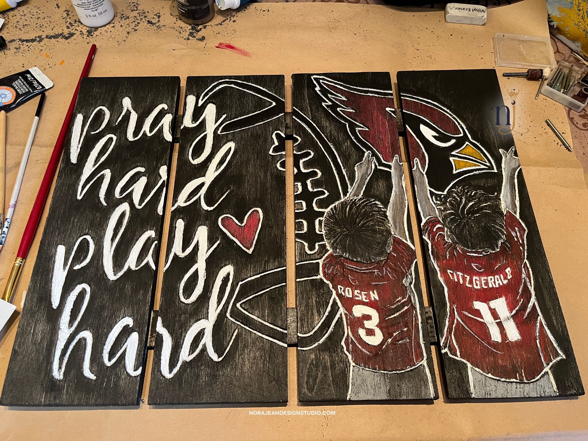 A wooden sign that says pray hard play hard on it