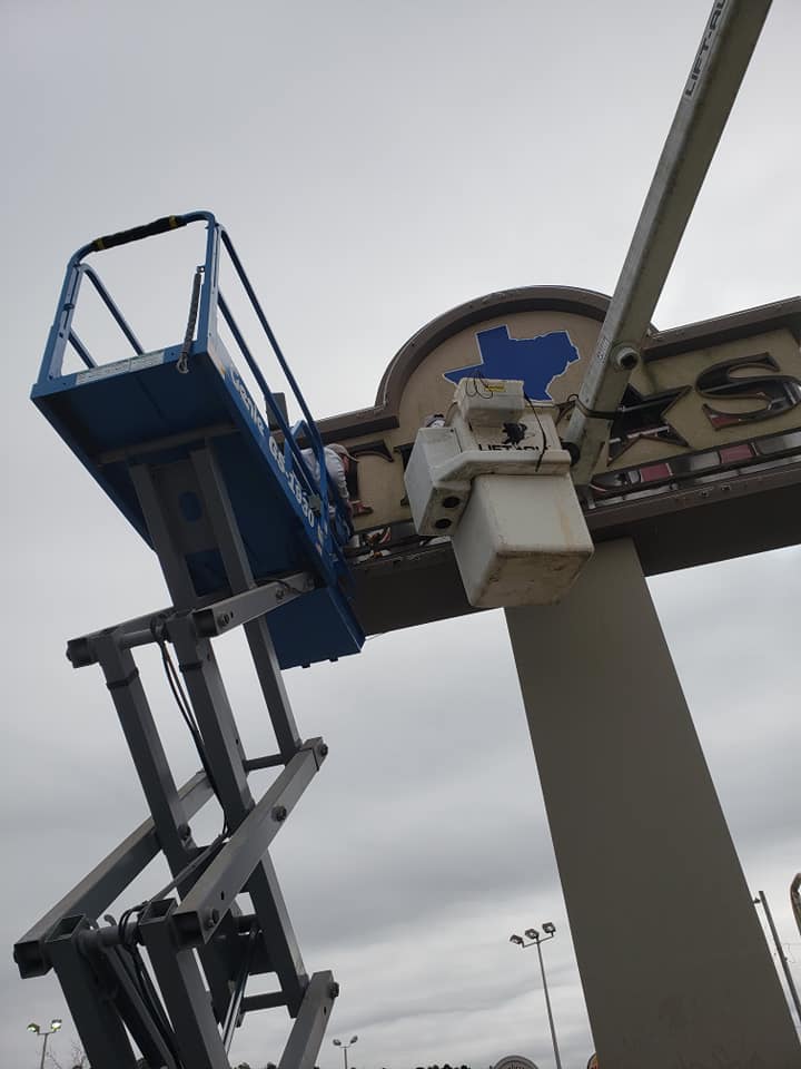 Store Signage Being Fixed — Lumberton, NC — Rogers Electric, Inc