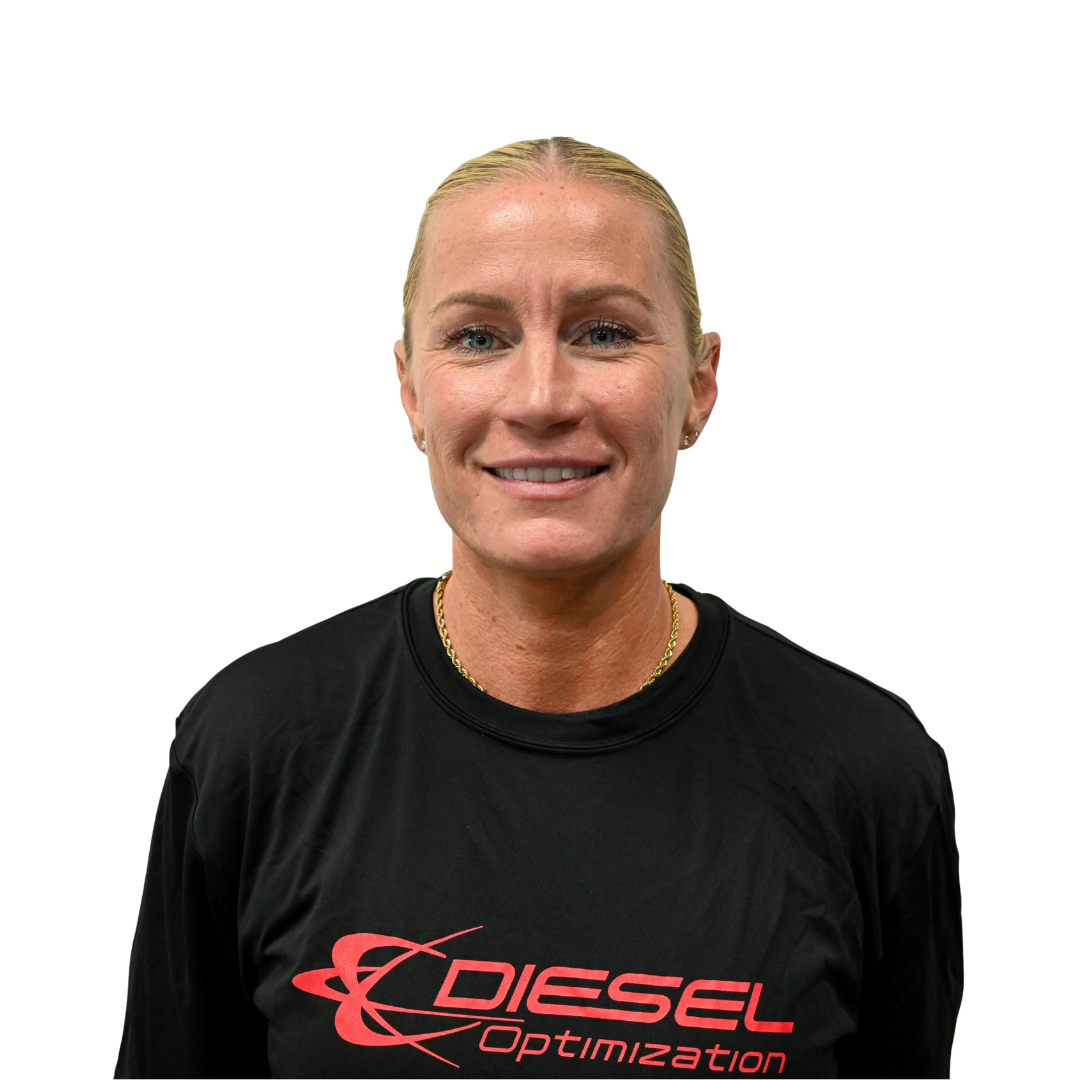 Woman with blonde bun smiles, wearing a black t-shirt with 