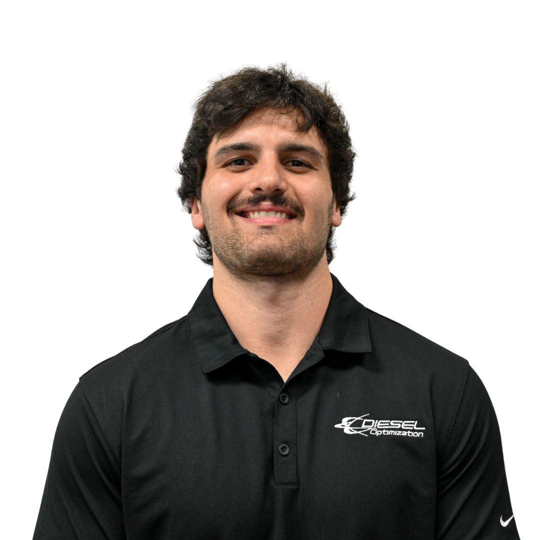 Man with dark hair and beard smiling, wearing a black t-shirt that says 