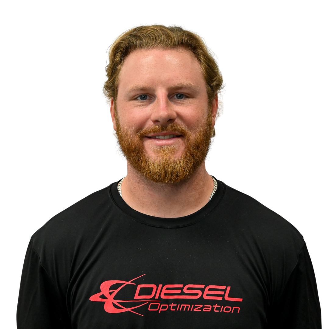 Woman with brown hair in a high ponytail smiling, wearing a gray t-shirt with 