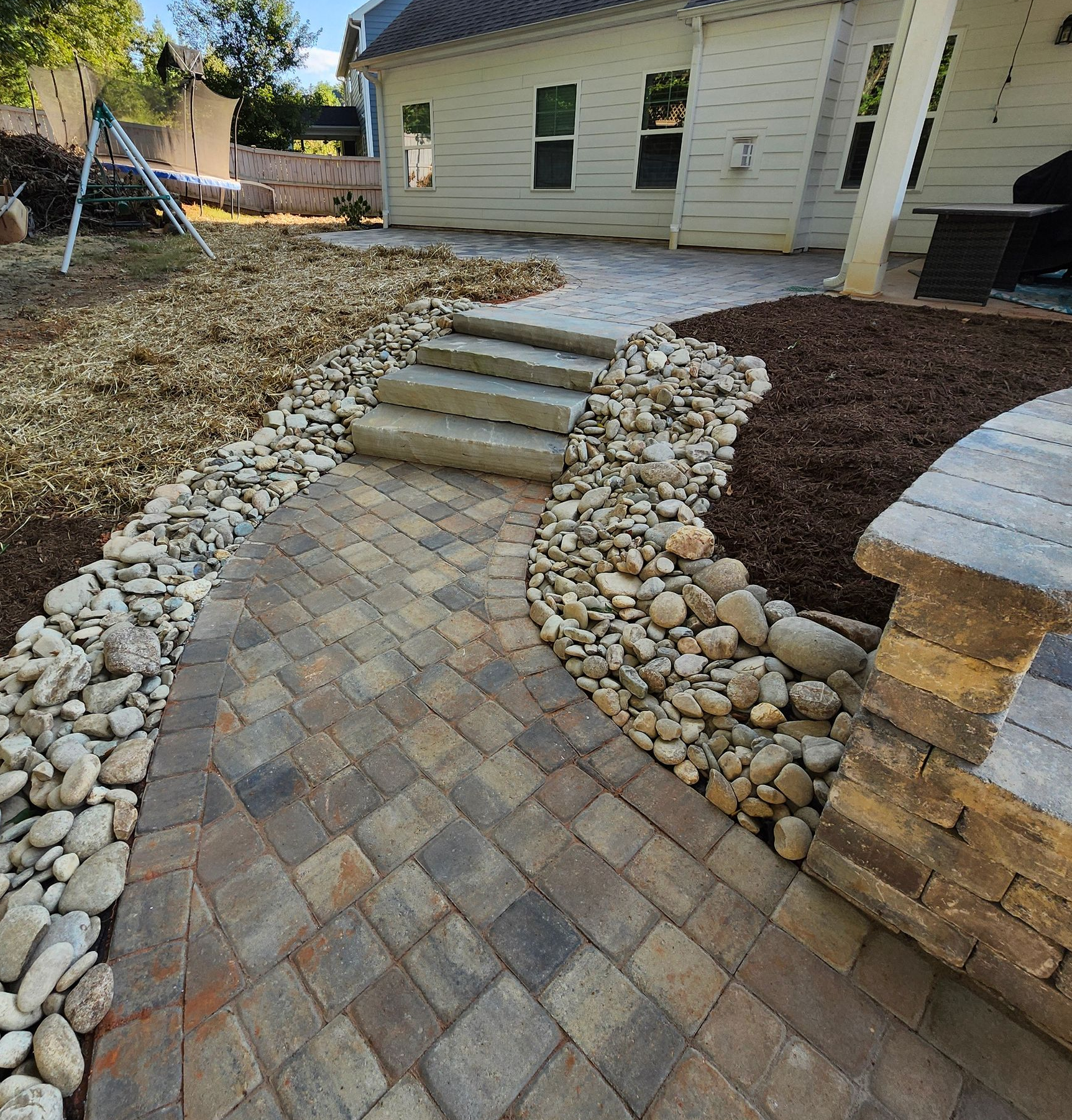 Natural stone steps between patios