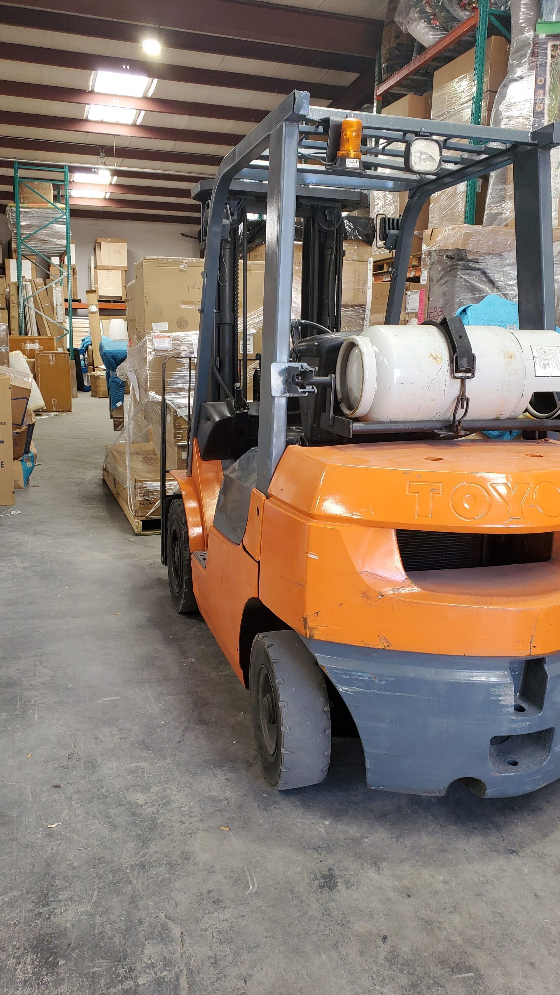 Fork truck moving Furniture and Receiving items at MUVR's short term storage facility