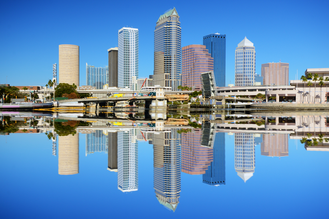 Tampa city sky line during the day reflecting off the Tampa Bay