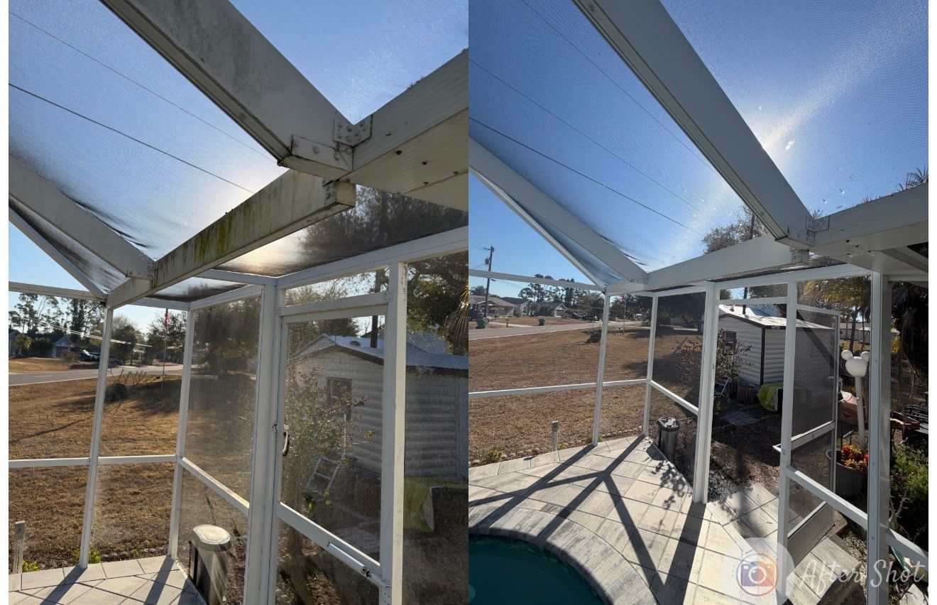 Stone paver walkway curves through a grassy yard and garden bed.