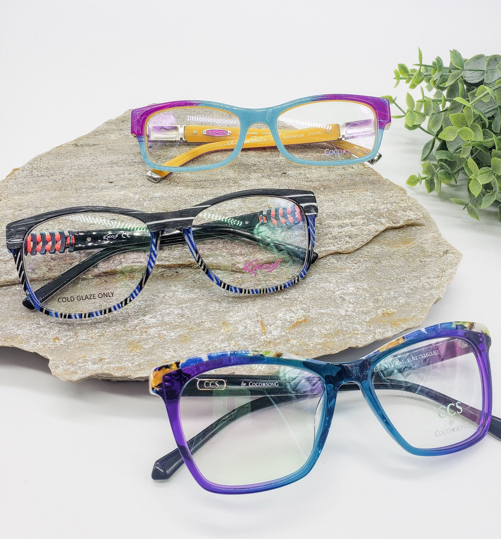 Top view flat lay of eye glasses and contact lenses — Noblesville, IN — Noble Optique